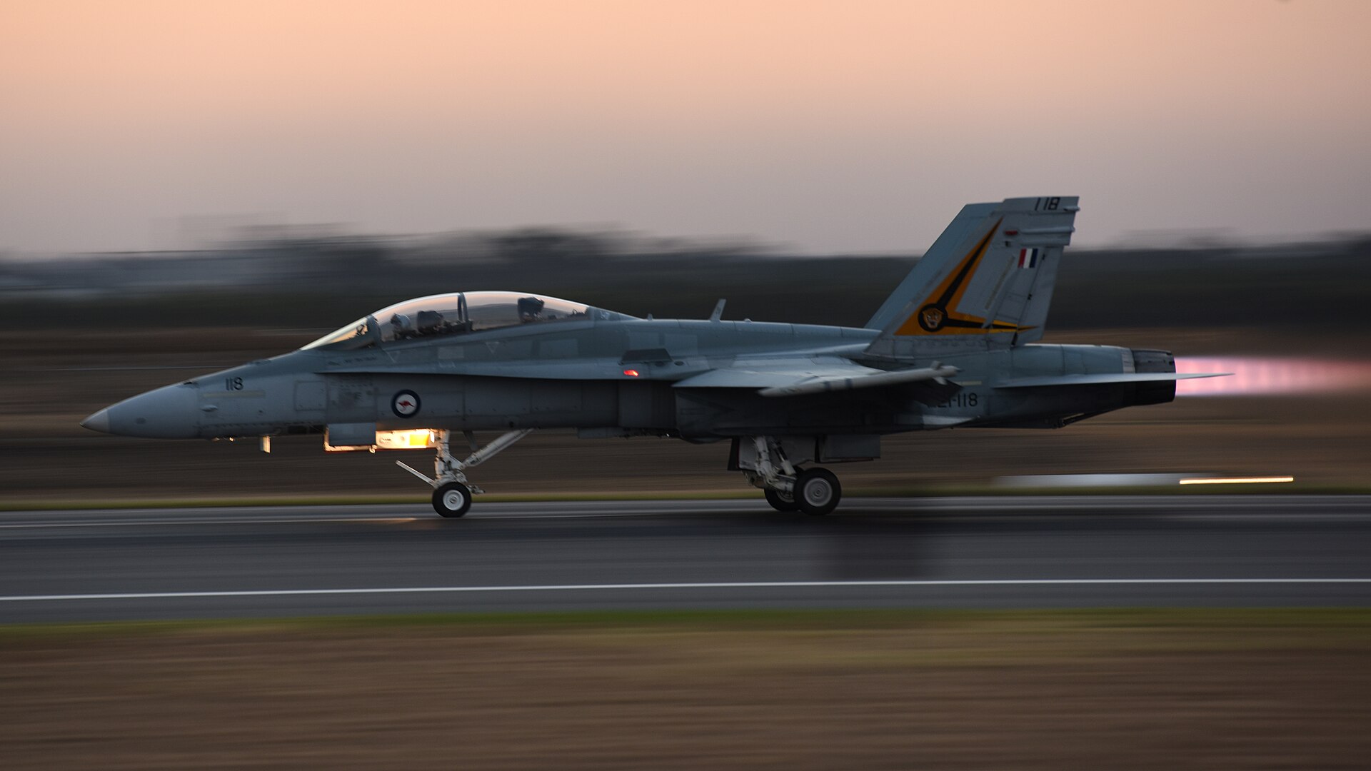 aircraft taking off dusk