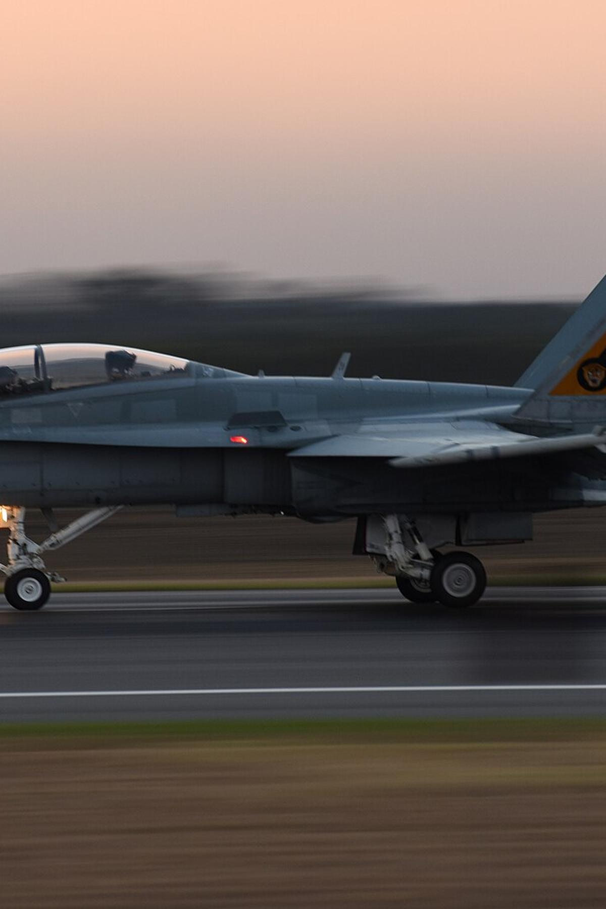 aircraft taking off dusk